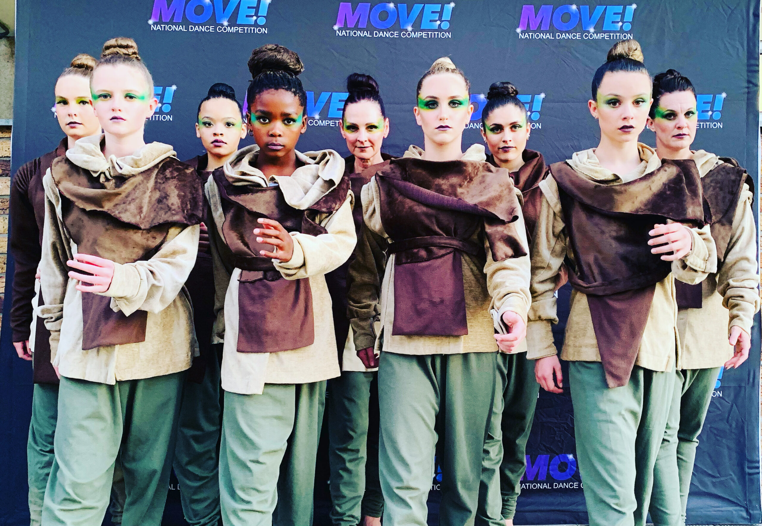 Outline Dance Centre - group move brown costumes