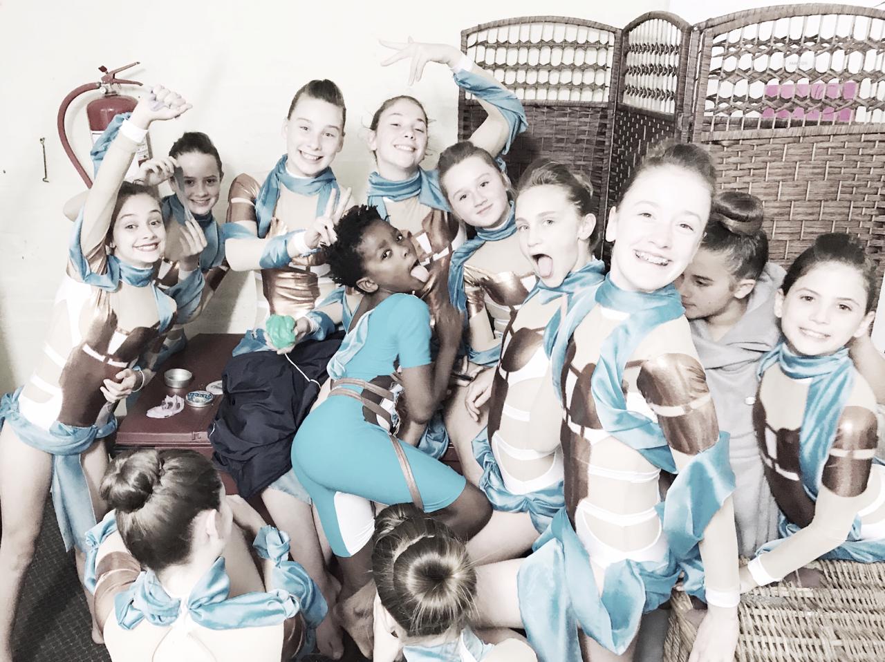 Outline Dance Centre junior group with trophies