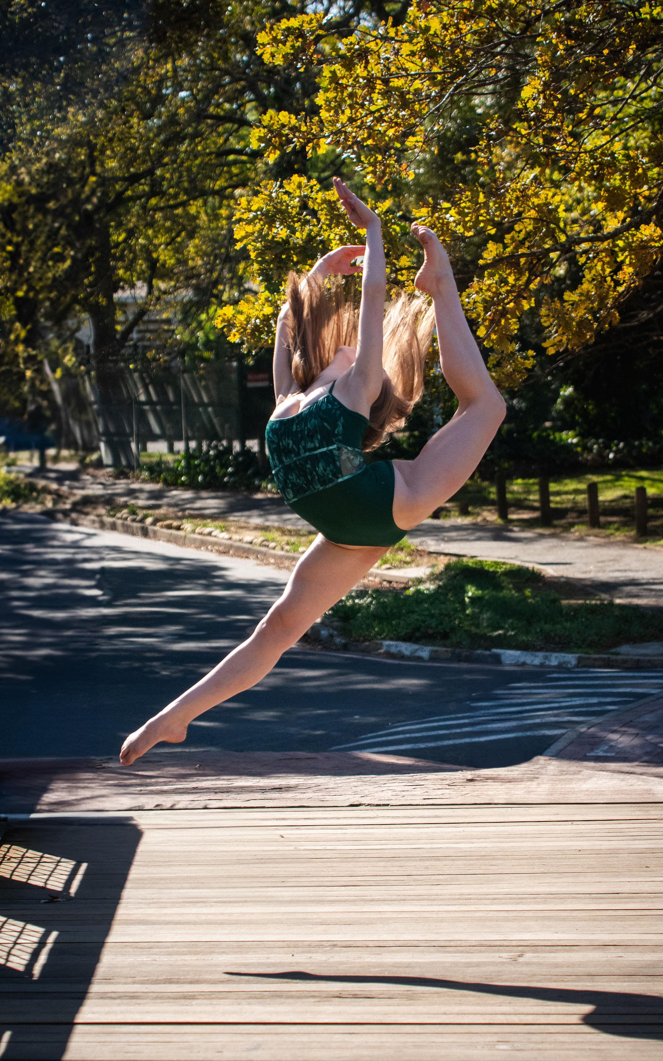 Outline Dance Centre - solo outdoor leap yellow trees
