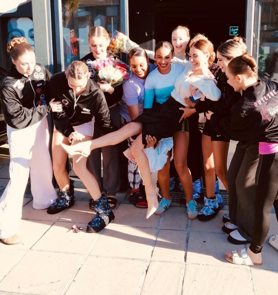 Outline Dance Centre - team celebration with baby